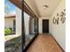 Inviting screened entrance featuring patterned flooring and decorative wall art at 5140 Kirkwood Ave, Spring Hill, FL 34608