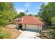 Charming home featuring a well-maintained lawn, two-car garage and a welcoming front entrance at 5140 Kirkwood Ave, Spring Hill, FL 34608