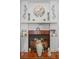 Close-up of the fireplace with decorative mantel, elegant decor, and warm ambiance at 5140 Kirkwood Ave, Spring Hill, FL 34608