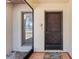 Inviting front door with decorative security screen and welcome mat, complemented by a sidelight window at 5140 Kirkwood Ave, Spring Hill, FL 34608