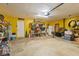 Two car garage with overhead lighting and yellow painted walls at 5140 Kirkwood Ave, Spring Hill, FL 34608