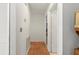 Hallway with terracotta tile flooring and white walls at 5140 Kirkwood Ave, Spring Hill, FL 34608