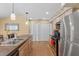 This kitchen features a double sink, modern lighting, and stainless steel appliances at 5140 Kirkwood Ave, Spring Hill, FL 34608