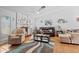 Bright living room with tile floors, comfortable seating, modern decor, and a decorative fireplace at 5140 Kirkwood Ave, Spring Hill, FL 34608