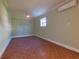 Bedroom with tile flooring, a ceiling fan and an AC unit at 5517 Jobeth Dr, New Port Richey, FL 34652