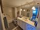 A clean and functional bathroom featuring a shower-tub combo and a vanity with ample counter space at 6020 Shore S Blvd # 902, Gulfport, FL 33707