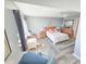 Cozy bedroom features wood flooring, natural light, and stylish furnishings at 6020 Shore S Blvd # 902, Gulfport, FL 33707