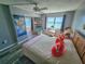 Bright bedroom with wood floors, stylish decor, and beautiful natural light with water views at 6020 Shore S Blvd # 902, Gulfport, FL 33707