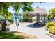 Community picnic area with a grill and a tiki hut-style shelter featuring seating at 6020 Shore S Blvd # 902, Gulfport, FL 33707