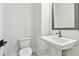 Stylish half-bathroom featuring modern fixtures, unique tile flooring, and a pedestal sink at 6605 N Nebraska Ave # 28, Tampa, FL 33604