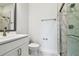 Modern bathroom with marble tile, glass shower enclosure, and sleek fixtures at 6605 N Nebraska Ave # 28, Tampa, FL 33604