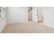 Bright bedroom with neutral carpet, ample natural light, and adjacent bathroom access at 6605 N Nebraska Ave # 28, Tampa, FL 33604