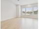 Bright living room featuring large windows, light wood floors, and modern design at 6605 N Nebraska Ave # 28, Tampa, FL 33604