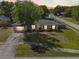 Dusk aerial front view of the home showing the front yard and landscaping at 7401 Hancock St, Riverview, FL 33578