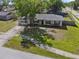 An aerial front view of the home showing the front yard and landscaping at 7401 Hancock St, Riverview, FL 33578