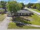 An aerial front view of the home showing the front yard and landscaping at 7401 Hancock St, Riverview, FL 33578
