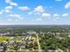 Scenic aerial view of a suburban community with a mix of residential and commercial areas, indicated with a red pin at 7401 Hancock St, Riverview, FL 33578