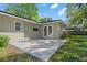 Home's back patio features tile floors, neutral paint, and access to the backyard at 7401 Hancock St, Riverview, FL 33578