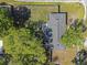 Aerial view of the backyard featuring a fenced-in yard with mature trees surrounding the property at 7401 Hancock St, Riverview, FL 33578