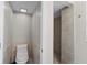 A view of the toilet and shower in the bathroom at 7401 Hancock St, Riverview, FL 33578