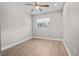 Clean, empty bedroom with wood floors and a window view at 7401 Hancock St, Riverview, FL 33578