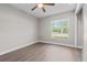 Bedroom with a window that provides natural light and hard wood floors at 7401 Hancock St, Riverview, FL 33578
