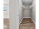 Walk-in closet features hardwood floors, wire rack shelving, and ample storage space at 7401 Hancock St, Riverview, FL 33578