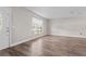 Inviting entryway showing hardwood flooring and light filled room at 7401 Hancock St, Riverview, FL 33578