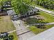 Charming single-story home with a well-maintained lawn, mature tree, and a long driveway at 7401 Hancock St, Riverview, FL 33578