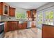 Renovated kitchen features wood cabinets, stainless steel appliances, tile backsplash, and stylish finishes at 7401 Hancock St, Riverview, FL 33578