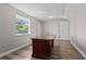 Spacious room features wood look floors, neutral paint, and large center island at 7401 Hancock St, Riverview, FL 33578