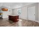 Spacious room features wood look floors, neutral paint, and large center island at 7401 Hancock St, Riverview, FL 33578