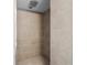 Modern shower features sleek, large-format tile and a mosaic tile floor at 7401 Hancock St, Riverview, FL 33578