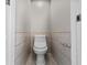 The toilet with decorative tiles and trim in the bathroom at 7401 Hancock St, Riverview, FL 33578