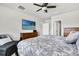 Primary bedroom with neutral paint, carpet, ceiling fan, and ensuite bathroom at 8352 Greenway Ave, Wesley Chapel, FL 33544
