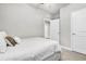Bright bedroom features plush bedding, neutral walls and carpet, and ample closet space at 8352 Greenway Ave, Wesley Chapel, FL 33544