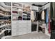 Walk-in closet with custom shelves, drawers, and hanging rods for optimal storage at 8352 Greenway Ave, Wesley Chapel, FL 33544