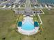 Aerial view of the sparkling community pool, lounge chairs, cabanas, and clubhouse at 8352 Greenway Ave, Wesley Chapel, FL 33544