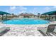 A large community pool surrounded by lounge chairs and shaded cabanas is perfect for summer fun at 8352 Greenway Ave, Wesley Chapel, FL 33544