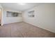 This carpeted bedroom offers dual windows, neutral walls, and ample natural light at 8445 Calais N, Pinellas Park, FL 33781