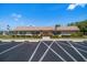 Welcoming community center with manicured landscaping and ample parking at 8445 Calais N, Pinellas Park, FL 33781