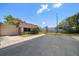 Well-maintained home exterior with a manicured lawn, driveway, and convenient attached garage at 8445 Calais N, Pinellas Park, FL 33781