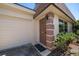 Inviting front entrance with a stylish door, adjacent to the garage, creating a welcoming feel at 8445 Calais N, Pinellas Park, FL 33781