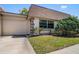Charming home with a well-maintained lawn and tidy landscaping, enhancing its curb appeal at 8445 Calais N, Pinellas Park, FL 33781