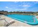 Community pool with lounge chairs for residents to enjoy at 8445 Calais N, Pinellas Park, FL 33781