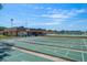 Well-maintained community shuffleboard courts with clubhouse in the background at 8445 Calais N, Pinellas Park, FL 33781