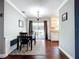 Elegant dining area with hardwood floors, stylish rug, and sliding glass doors to the patio at 910 Lakeside Dr, Largo, FL 33778