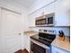 Kitchen showcases stainless steel microwave and oven appliances at 910 Lakeside Dr, Largo, FL 33778
