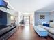 Bright living area flowing into dining, featuring hardwood floors and views of the backyard at 910 Lakeside Dr, Largo, FL 33778