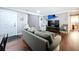 Well-lit living room featuring modern furniture, hardwood floors, and a unique sailfish decoration at 910 Lakeside Dr, Largo, FL 33778